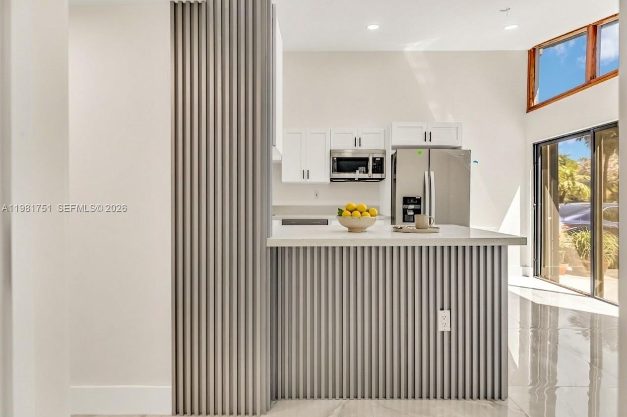 9332 Southwest 132nd Street Miami, FL 33176 - Photo 3 of 16 a view of a kitchen with a window