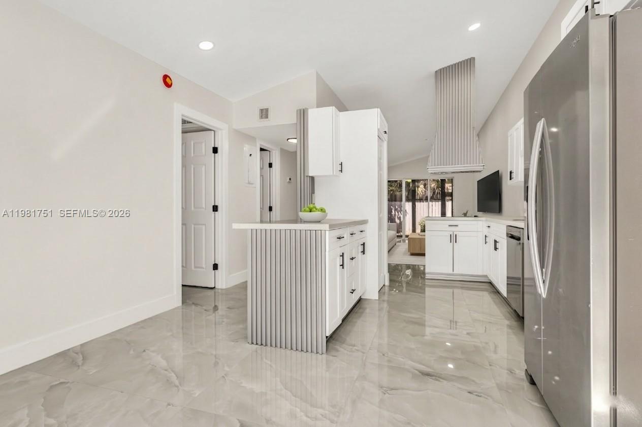 9332 Southwest 132nd Street Miami, FL 33176 - Photo 4 of 16 a view of a kitchen with refrigerator and windows