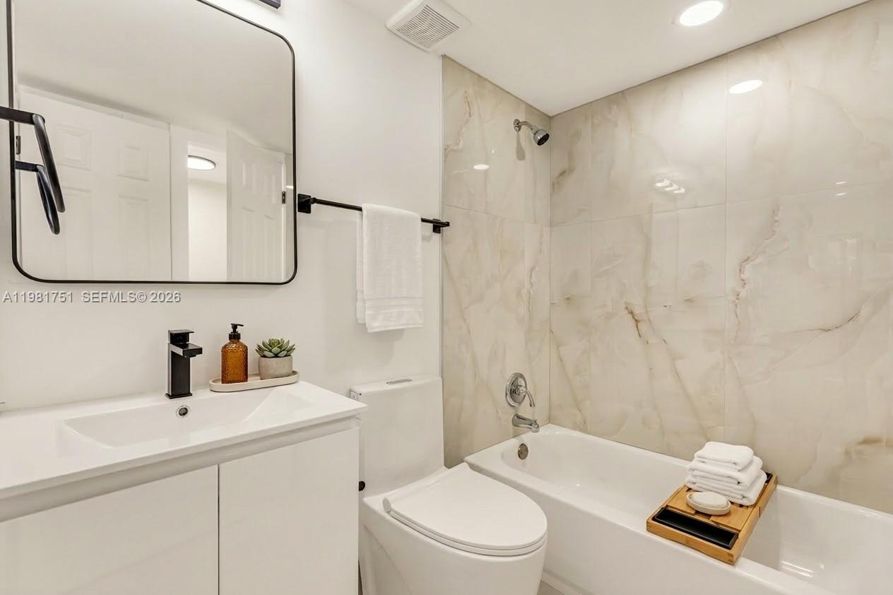 9332 Southwest 132nd Street Miami, FL 33176 - Photo 10 of 16 a bathroom with a sink a toilet and shower