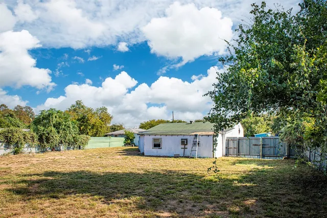 an aerial view of a house with a lake view