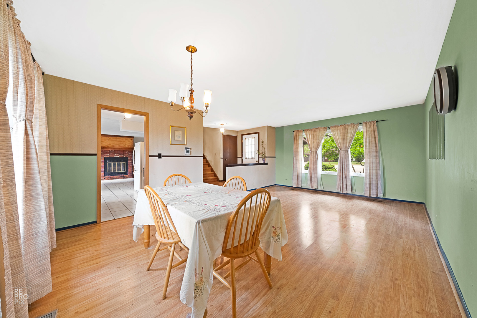 1901 Crescent Lane Hoffman Estates, IL 60169 - Photo 2 of 12 a view of a dining room with furniture window and wooden floor