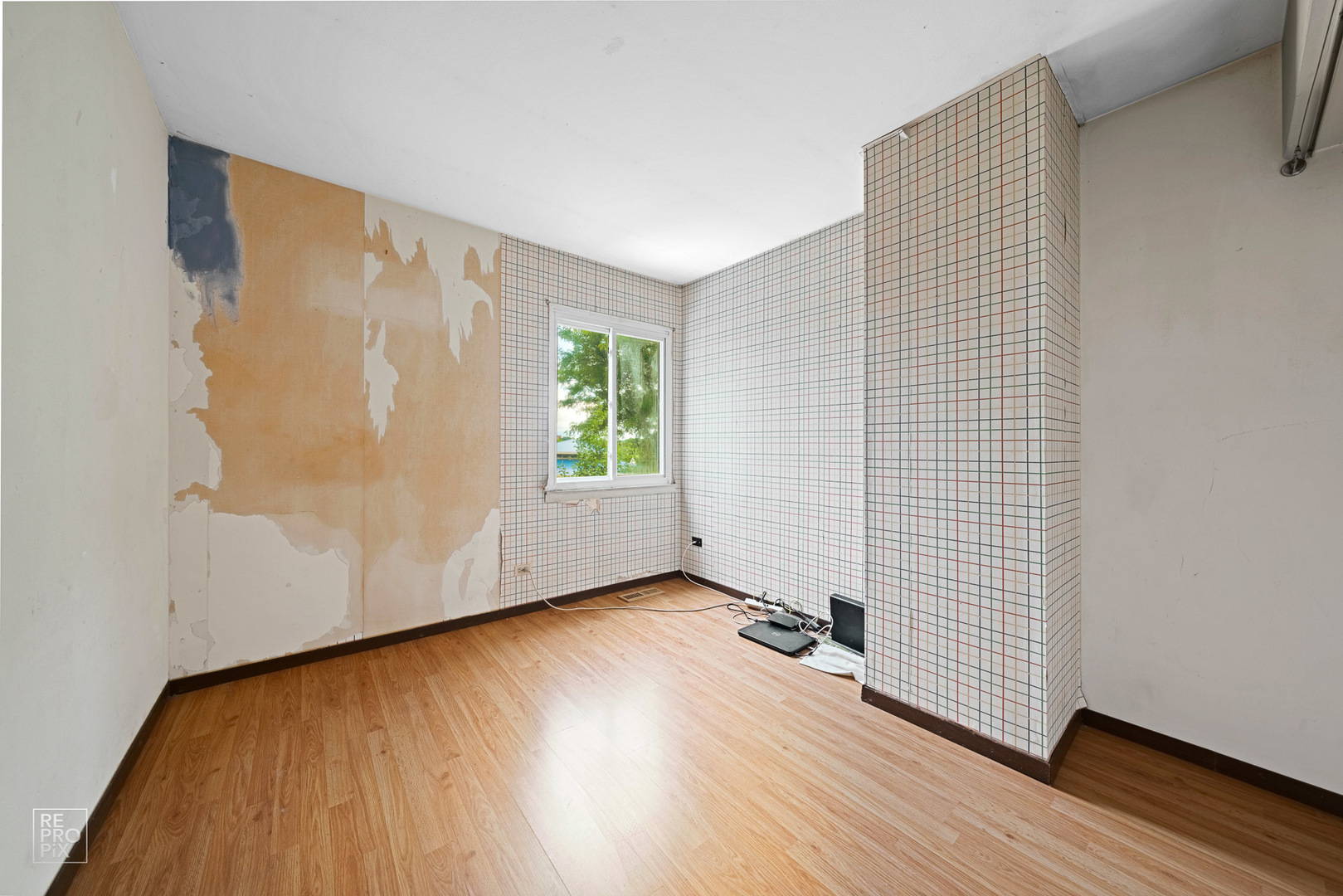 1901 Crescent Lane Hoffman Estates, IL 60169 - Photo 9 of 12 an empty room with wooden floor and windows