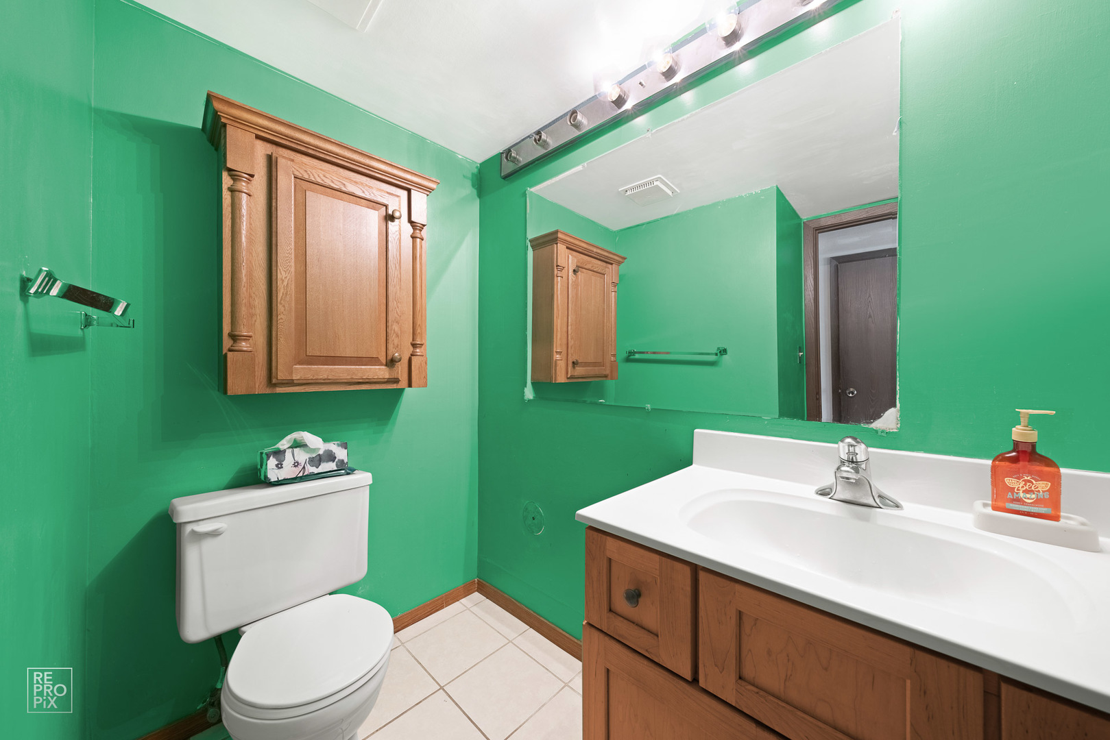 1901 Crescent Lane Hoffman Estates, IL 60169 - Photo 10 of 12 a bathroom with a sink vanity mirror and toilet