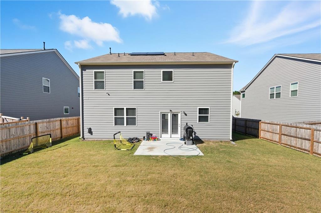 7565 Jennadee Drive Fairburn, GA 30213 - Photo 31 of 42 a view of a house with a patio