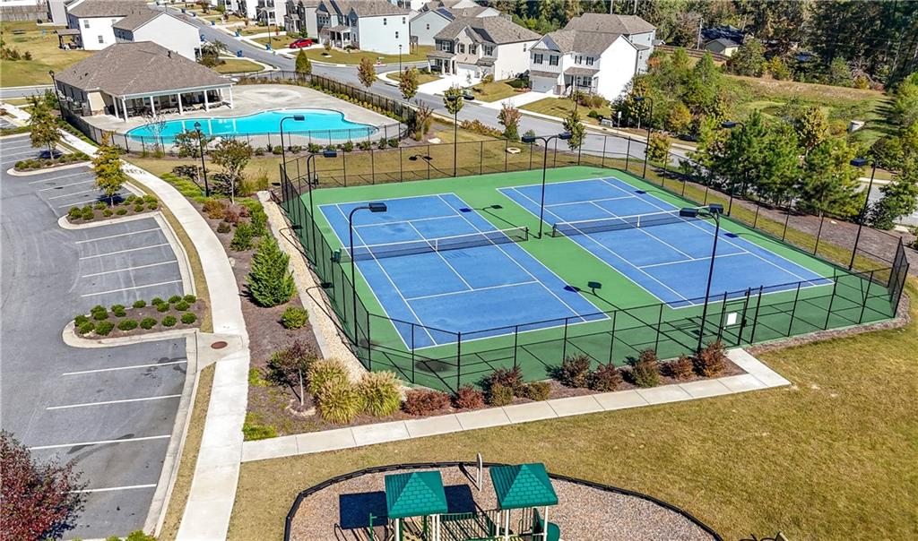 7565 Jennadee Drive Fairburn, GA 30213 - Photo 38 of 42 an aerial view of a house with swimming pool and outdoor seating