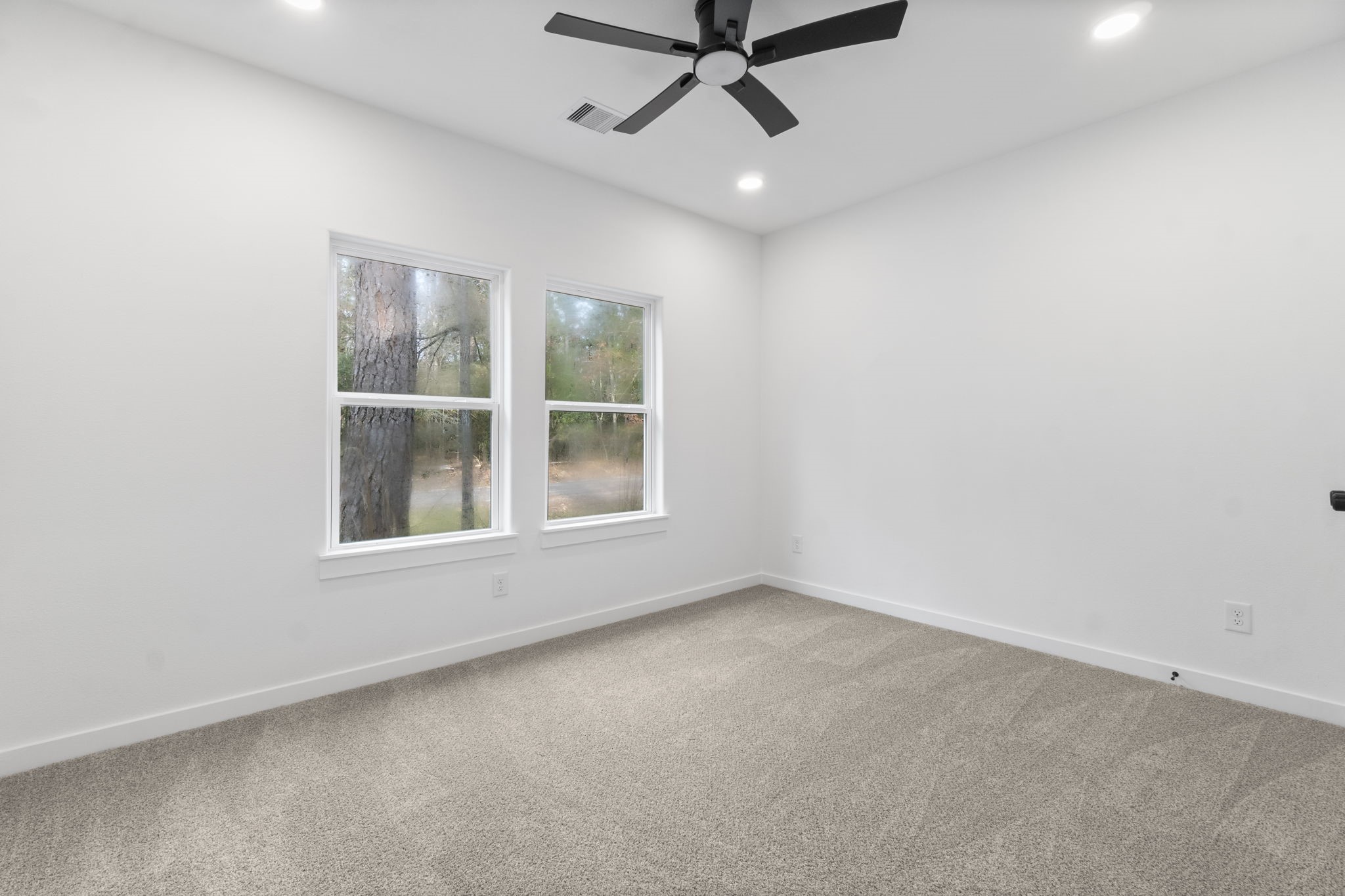 241 Clear Springs Trinity, TX 75862 - Photo 29 of 46 an empty room with a window and a fan