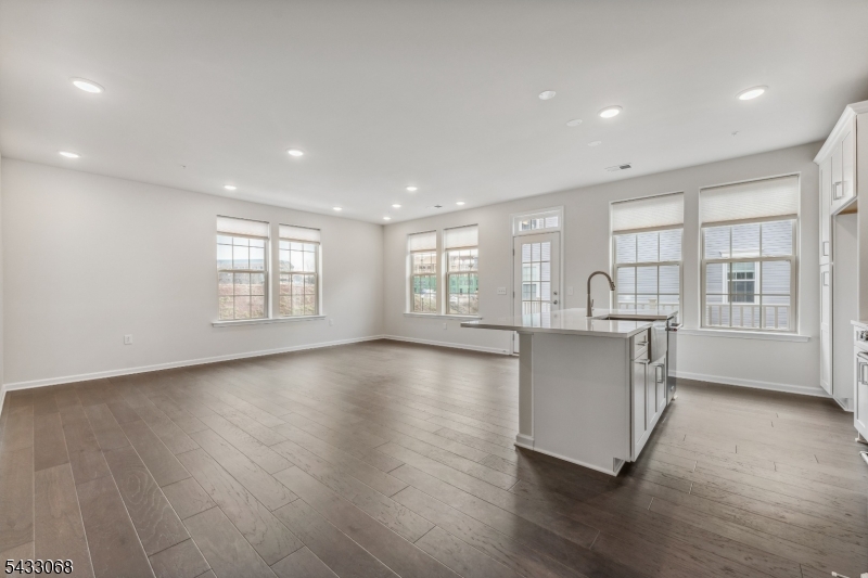3 Sternadori Road Somerville, NJ 08876 - Photo 8 of 22 a view of an empty room with wooden floor and a window