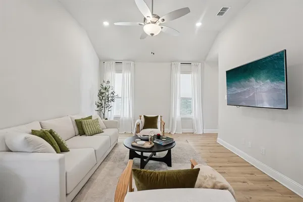 a living room with furniture and a couch