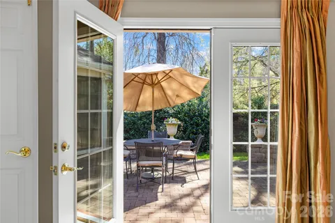 a view of a chair and table in the balcony
