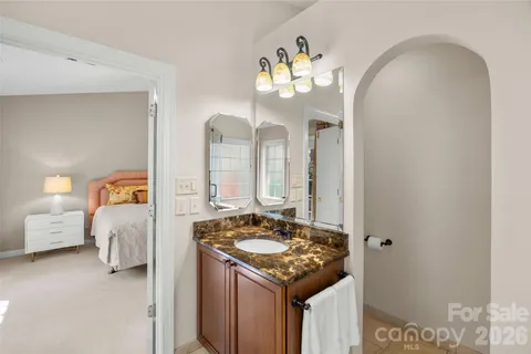 a en suite bathroom with a sink and a mirror