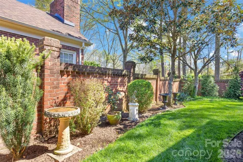 a front view of a house with a yard table and chairs