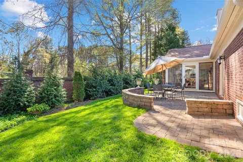 a view of a house with sitting area and garden