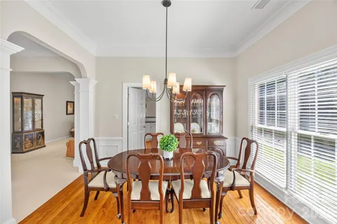a view of a dining room with furniture and window