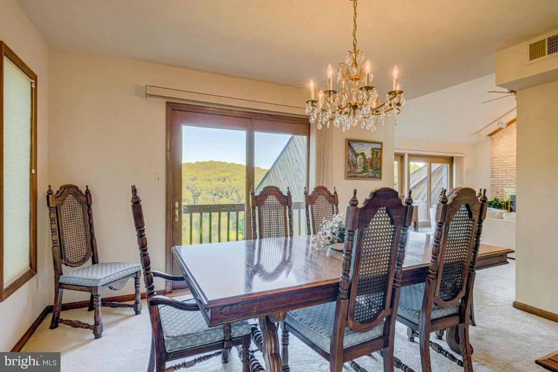 14 Wetherbee Court Phoenix, MD 21131 - Photo 14 of 64 Dining with balcony and views