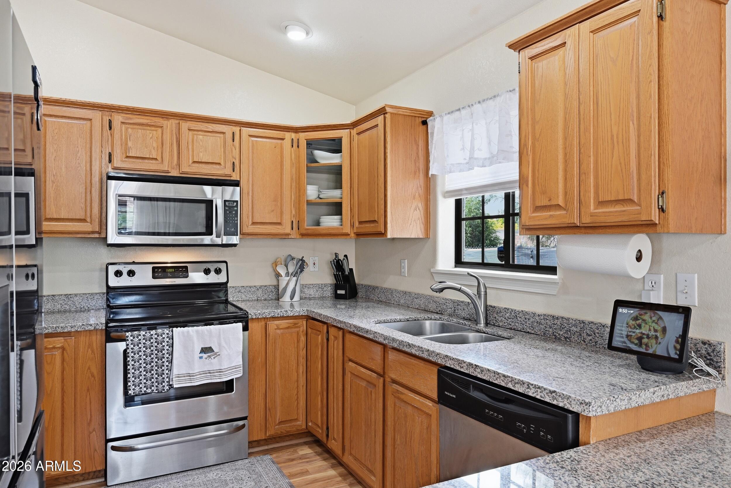 905 West Prairie Road Payson, AZ 85541 - Photo 14 of 38 a kitchen with stainless steel appliances granite countertop a stove a sink and a microwave
