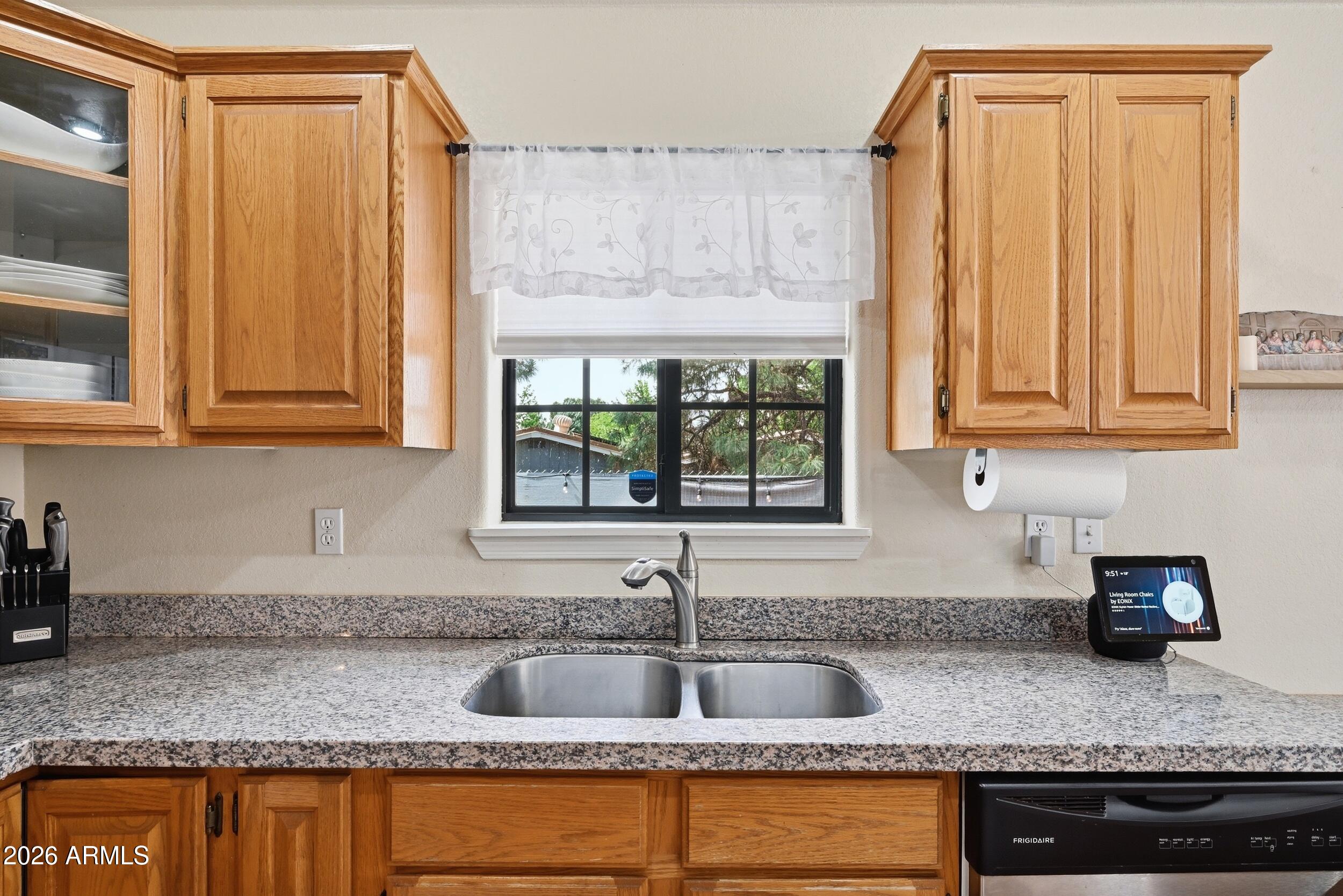 905 West Prairie Road Payson, AZ 85541 - Photo 15 of 38 a kitchen with granite countertop a sink window and cabinets