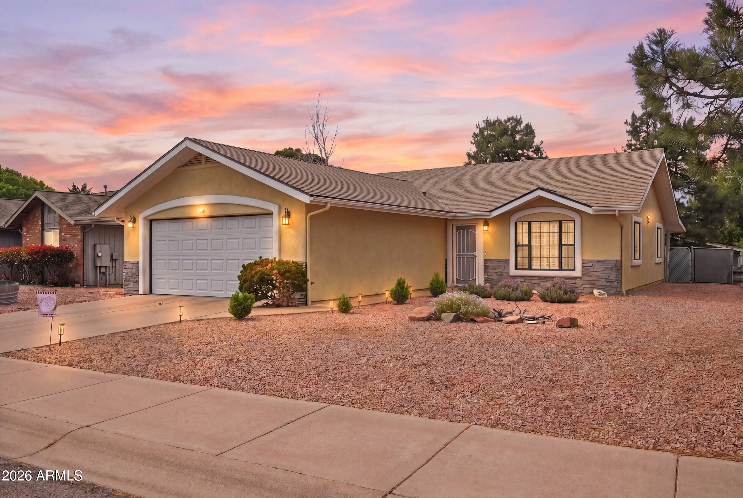 905 West Prairie Road Payson, AZ 85541 - Photo 2 of 38 a front view of a house with a yard