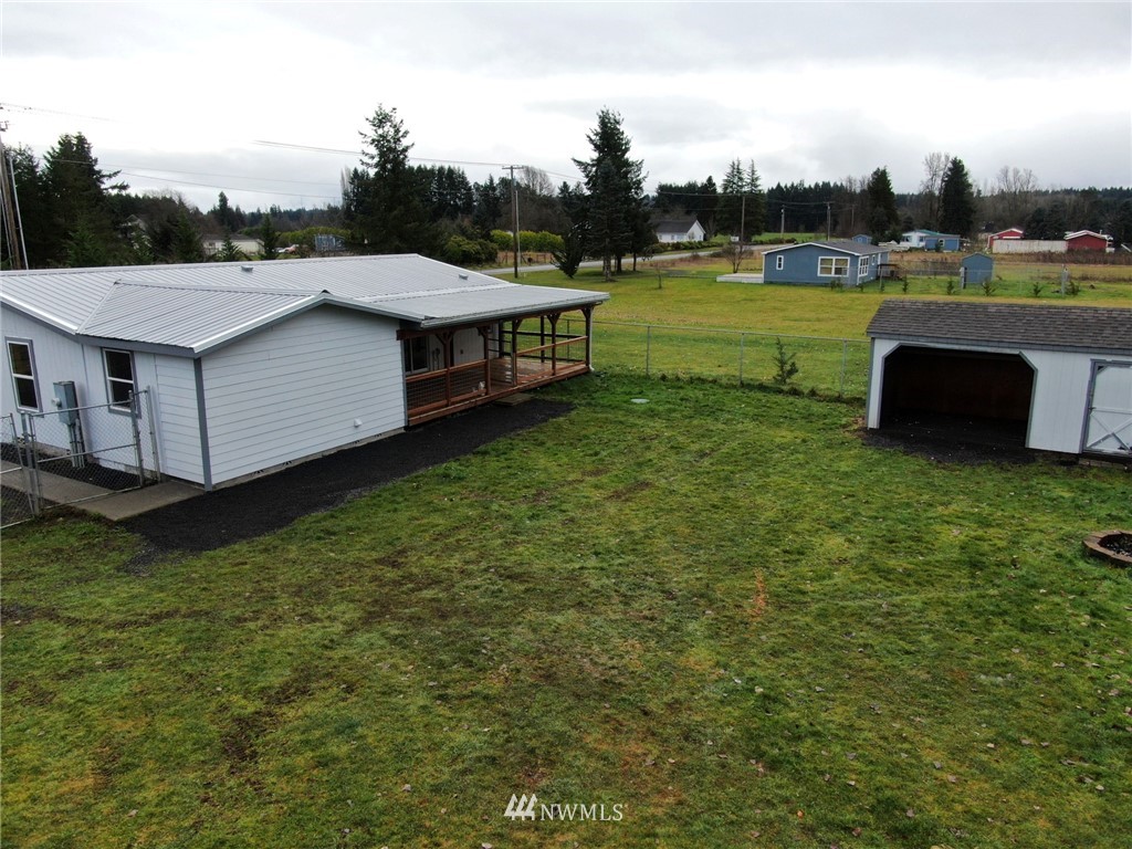 18337 Forstrom Street Southwest Rochester, WA 98579 - Photo 24 of 26 a view of a house with a yard table and chairs