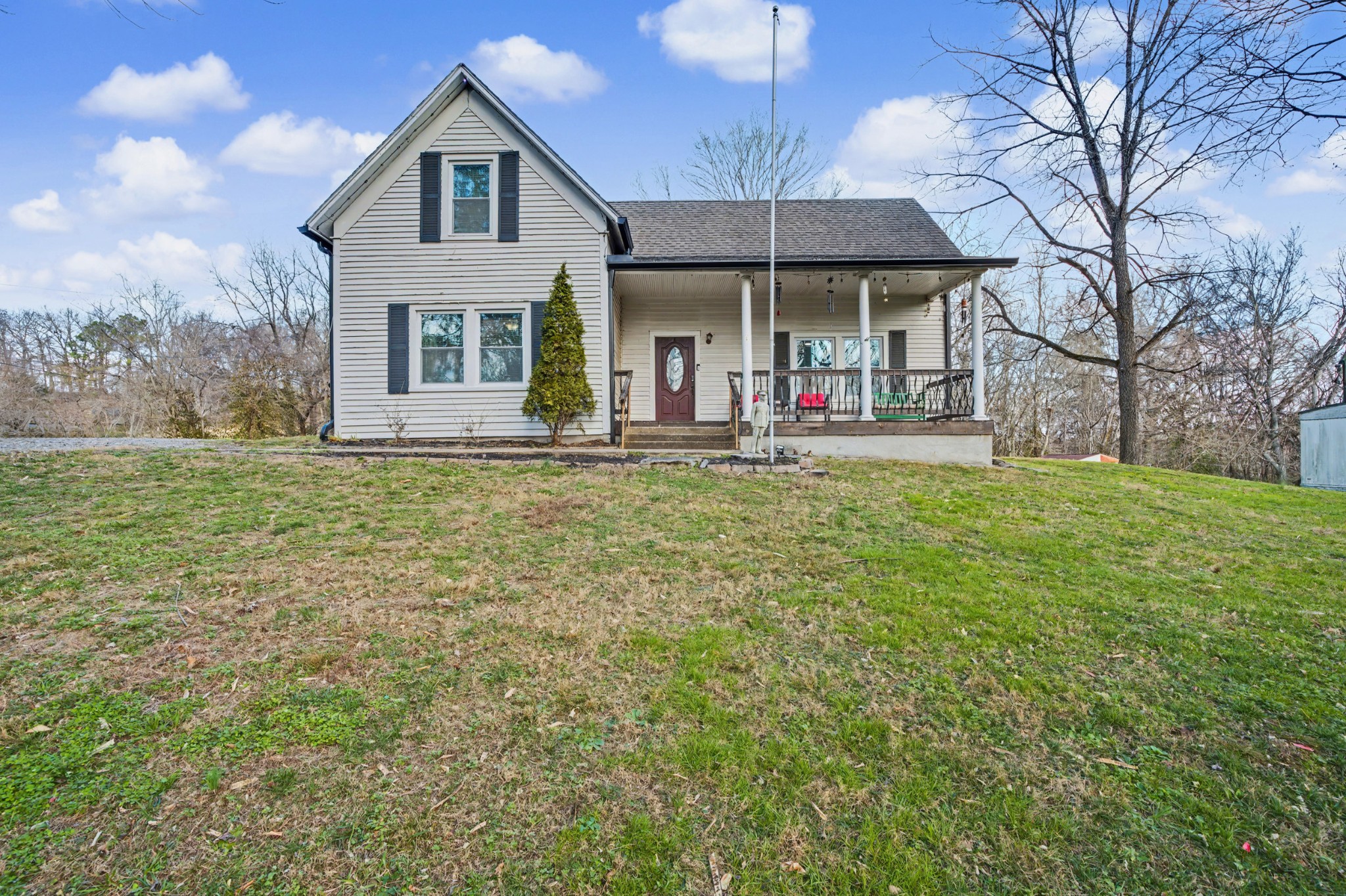116 Tracy Academy Street Charlotte, TN 37036 - Photo 1 of 36 a view of a house with a large window and a yard