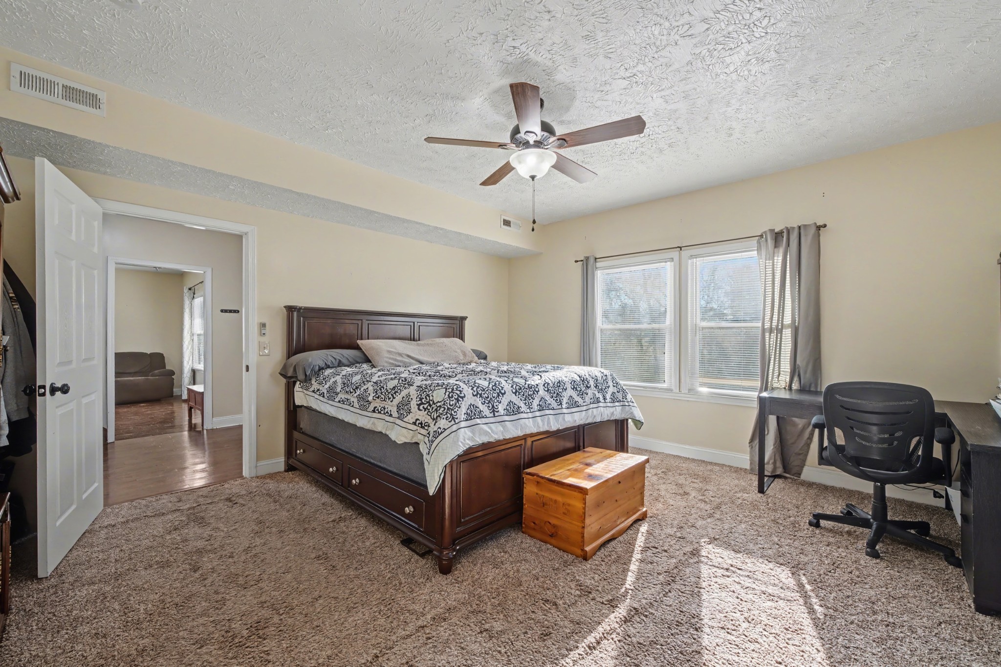 116 Tracy Academy Street Charlotte, TN 37036 - Photo 16 of 36 a bedroom with a bed chair and window