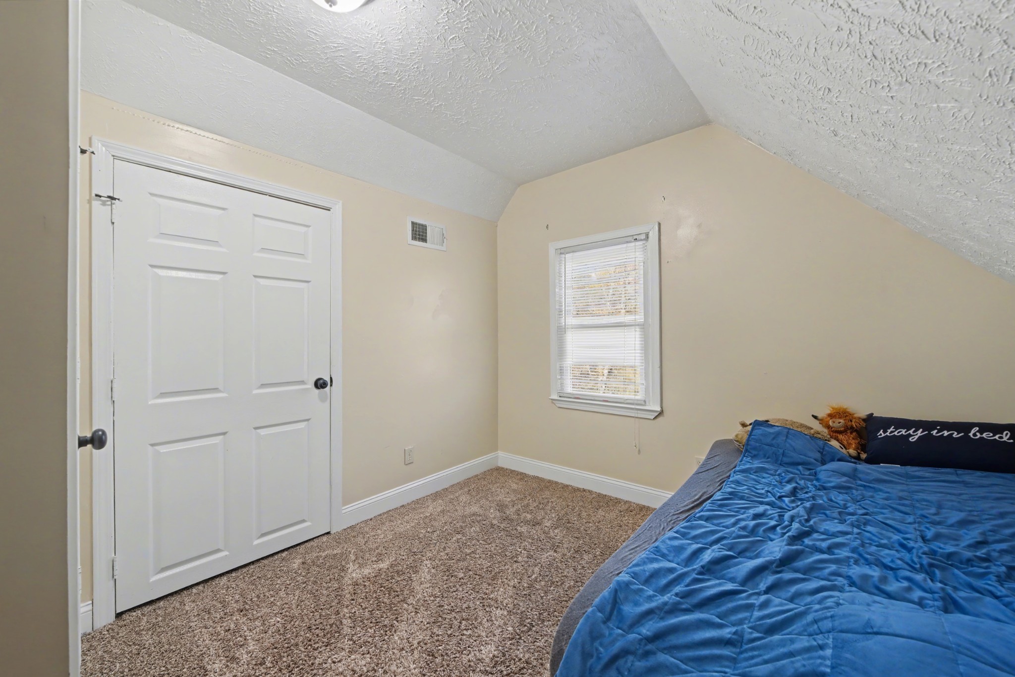116 Tracy Academy Street Charlotte, TN 37036 - Photo 22 of 36 a bed room with a bed and a window