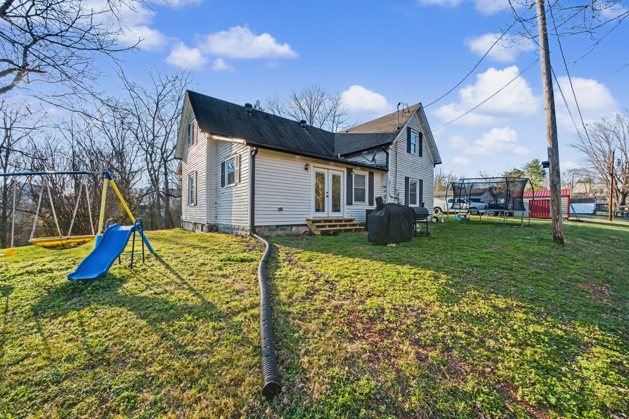 116 Tracy Academy Street Charlotte, TN 37036 - Photo 28 of 36 a view of a house with a yard