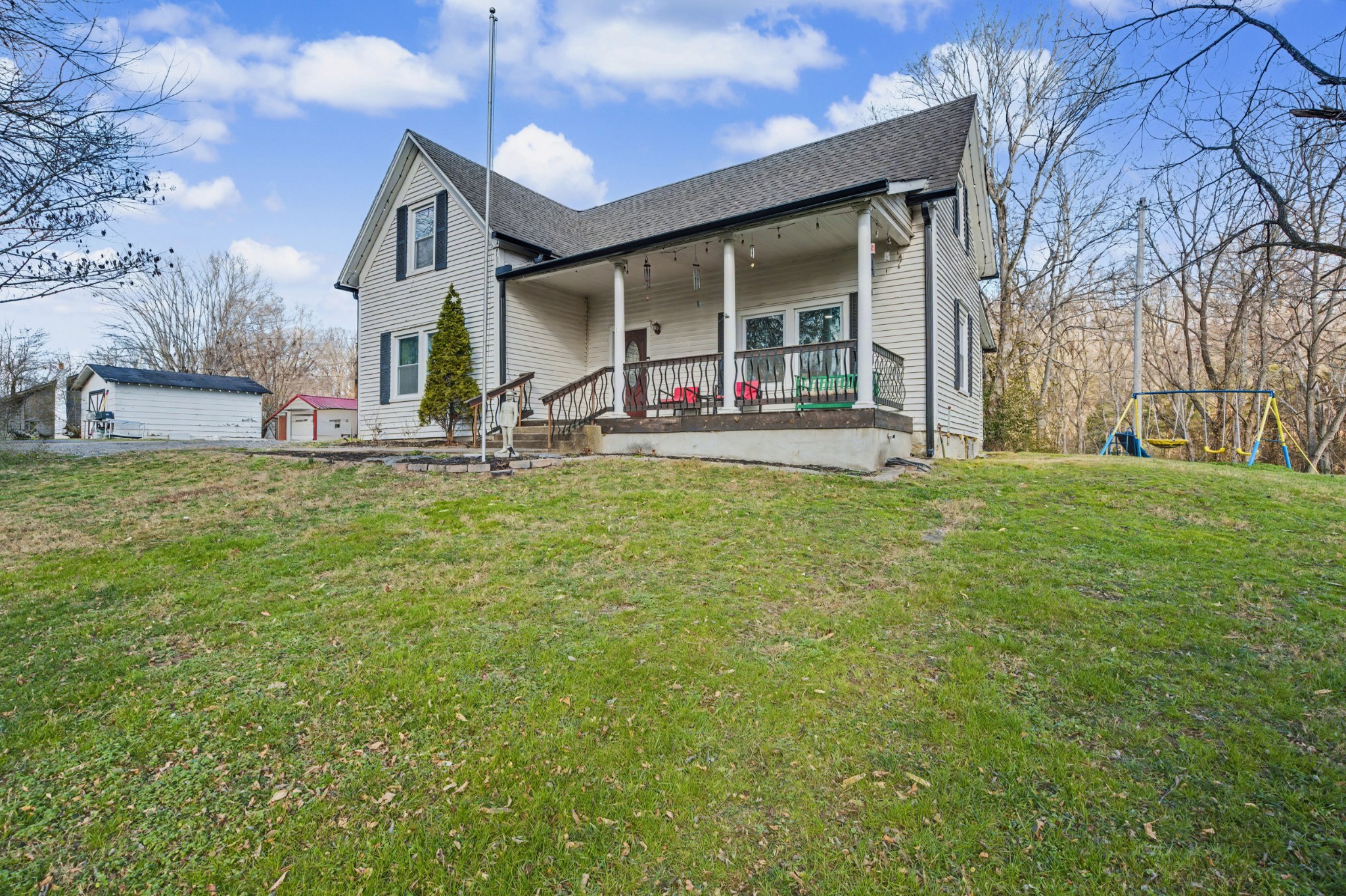 116 Tracy Academy Street Charlotte, TN 37036 - Photo 3 of 36 a view of a house with a big yard and large tree