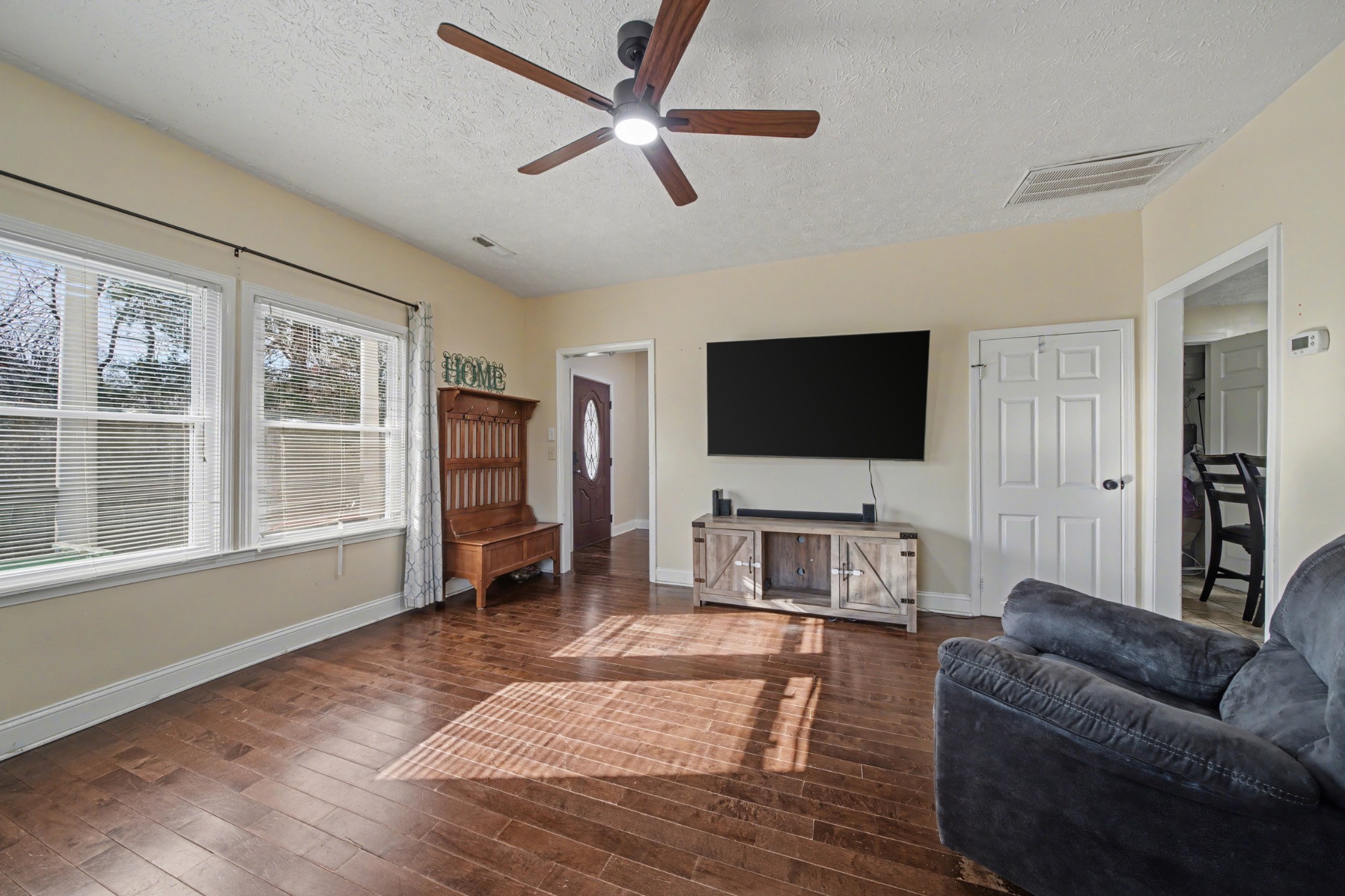 116 Tracy Academy Street Charlotte, TN 37036 - Photo 7 of 36 a living room with furniture and a flat screen tv