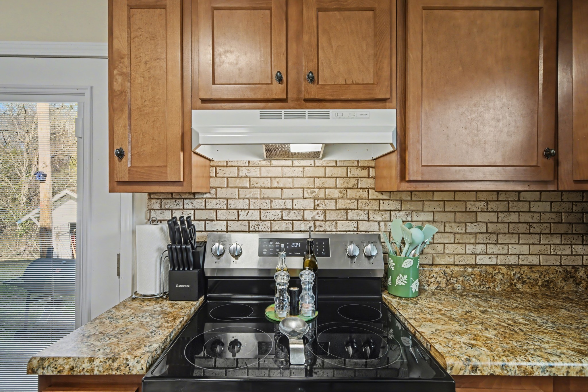 116 Tracy Academy Street Charlotte, TN 37036 - Photo 10 of 36 a kitchen with a stove and cabinets