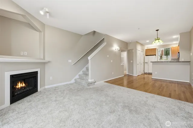 a view of an empty room with a fireplace
