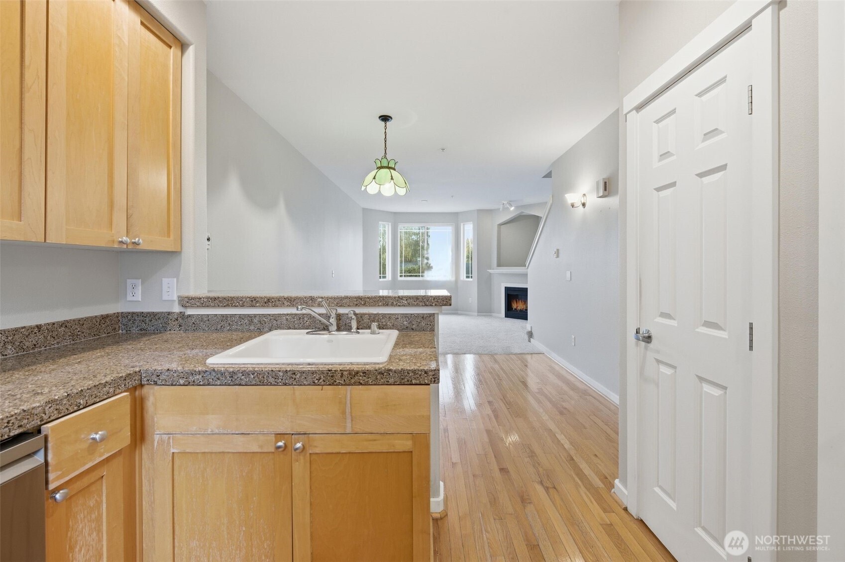 210 North G Street, Unit D Tacoma, WA 98403 - Photo 5 of 19 a bathroom with a granite countertop sink a mirror and a shower