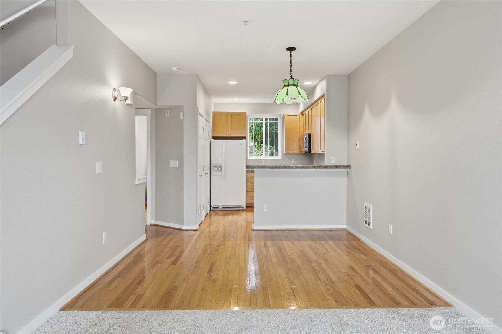 210 North G Street, Unit D Tacoma, WA 98403 - Photo 7 of 19 a view of a kitchen with a sink and wooden floor