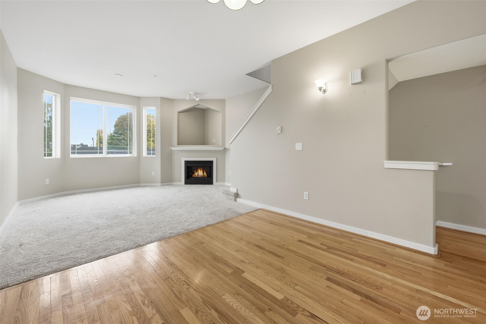 210 North G Street, Unit D Tacoma, WA 98403 - Photo 8 of 19 an empty room with windows and fireplace