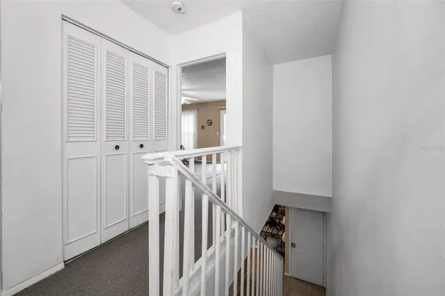an aerial view of a house with a swimming pool