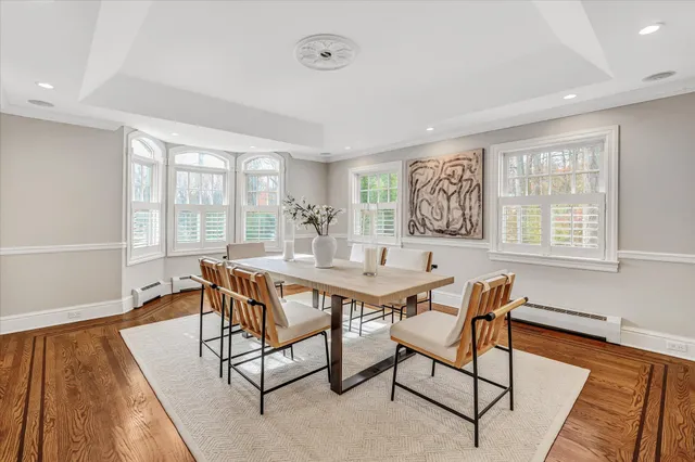 a view of a dining room with furniture and window