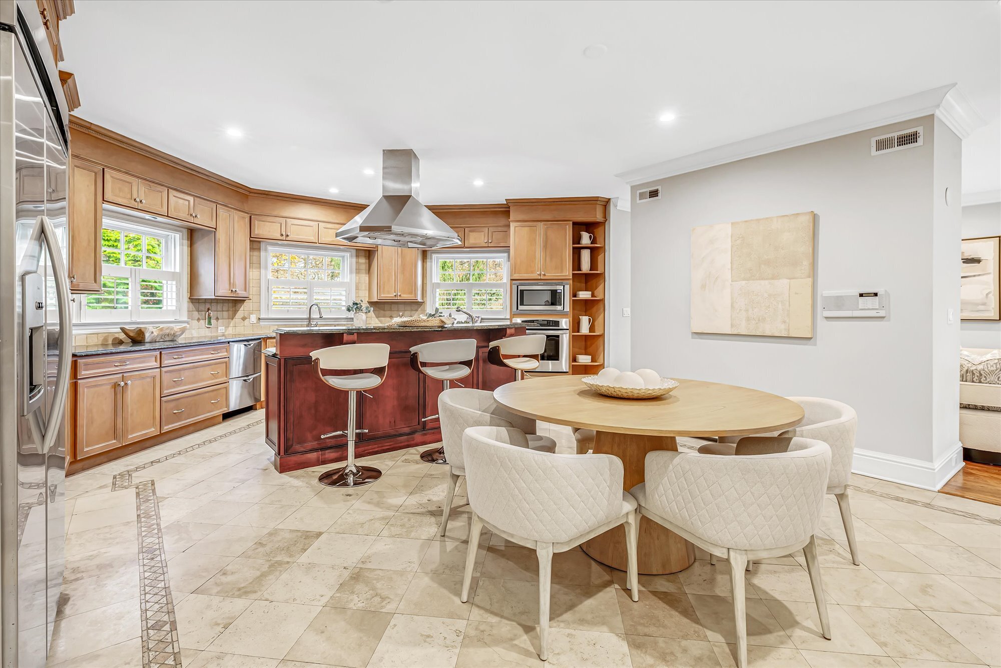 139 Jelliff Mill Road New Canaan, CT 06840 - Photo 18 of 40 a kitchen with a dining table chairs and window