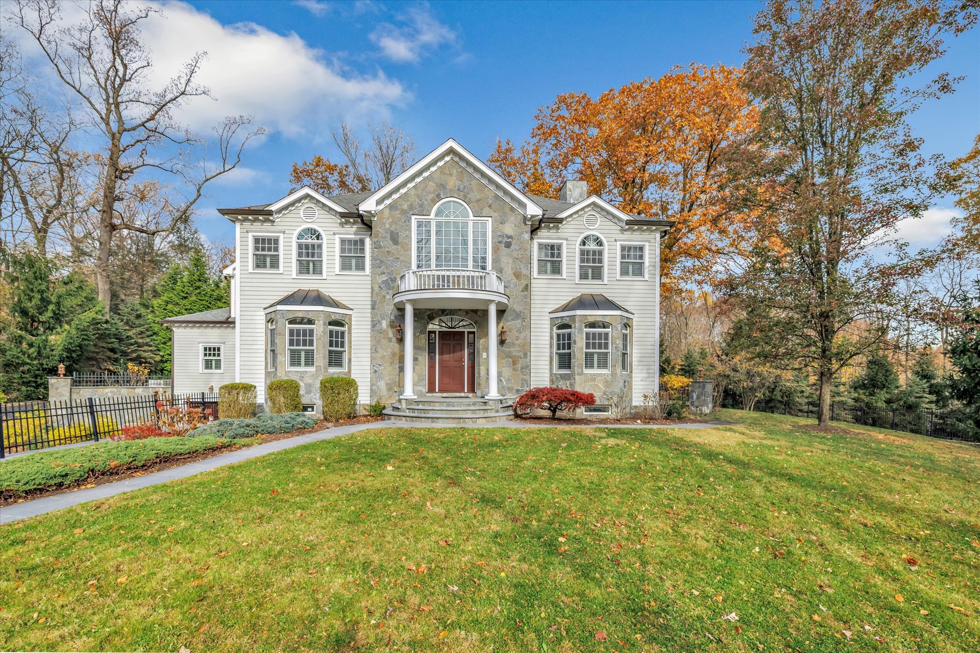 139 Jelliff Mill Road New Canaan, CT 06840 - Photo 1 of 40 a front view of a house with a yard