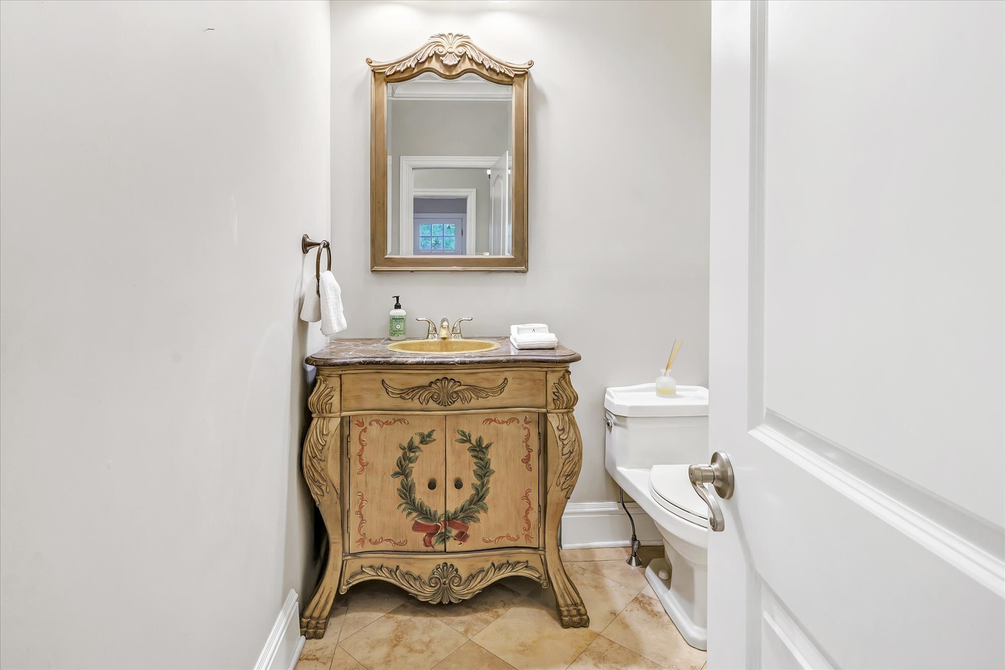 139 Jelliff Mill Road New Canaan, CT 06840 - Photo 22 of 40 a bathroom with a toilet a sink and mirror