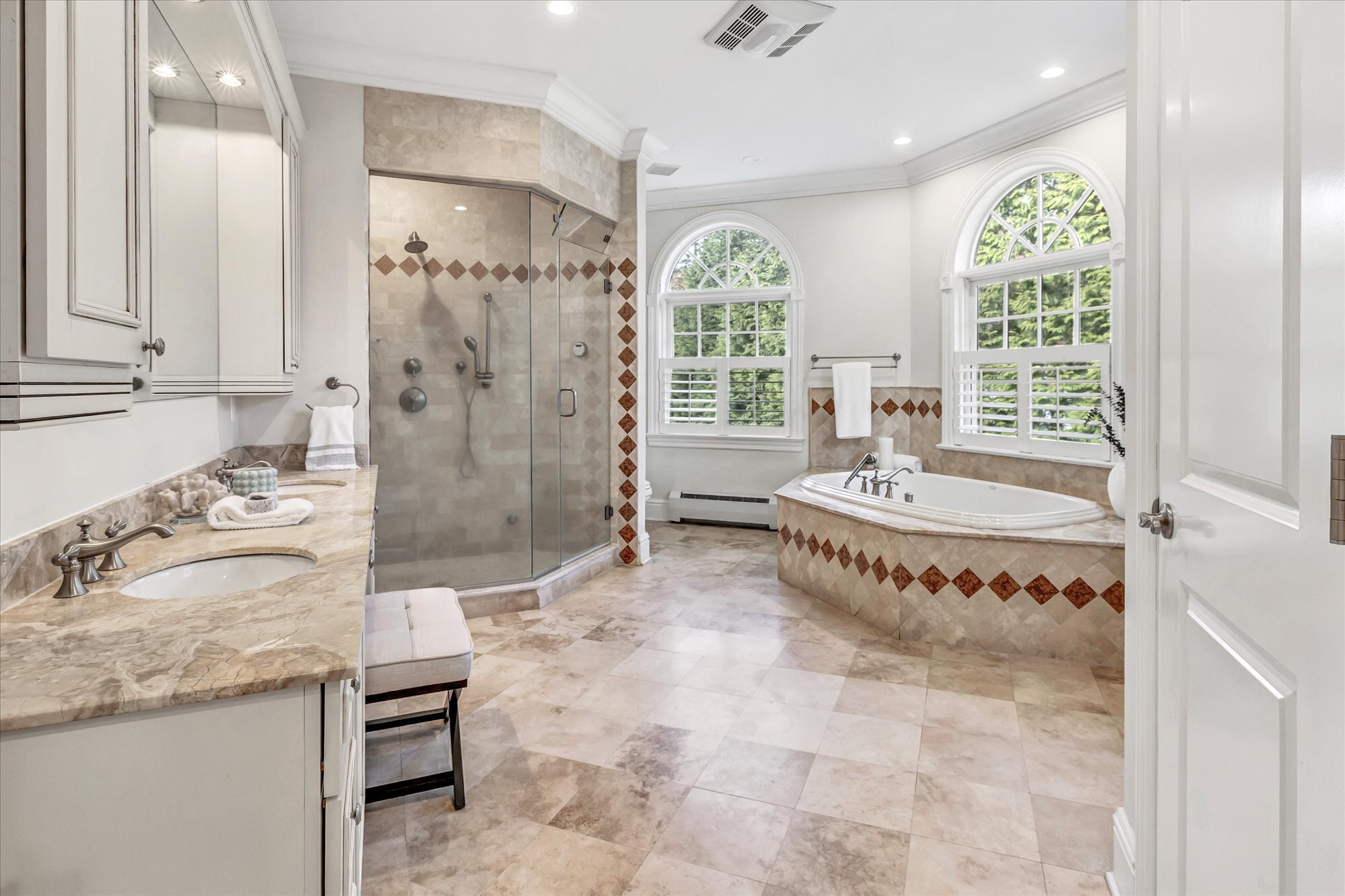 139 Jelliff Mill Road New Canaan, CT 06840 - Photo 27 of 40 a spacious bathroom with a tub sink and mirror