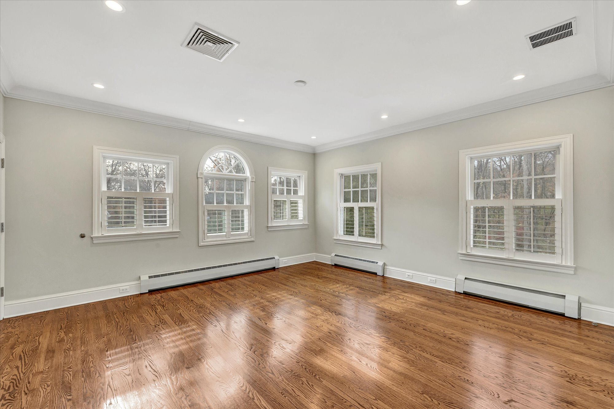 139 Jelliff Mill Road New Canaan, CT 06840 - Photo 28 of 40 a view of an empty room with a window and wooden floor