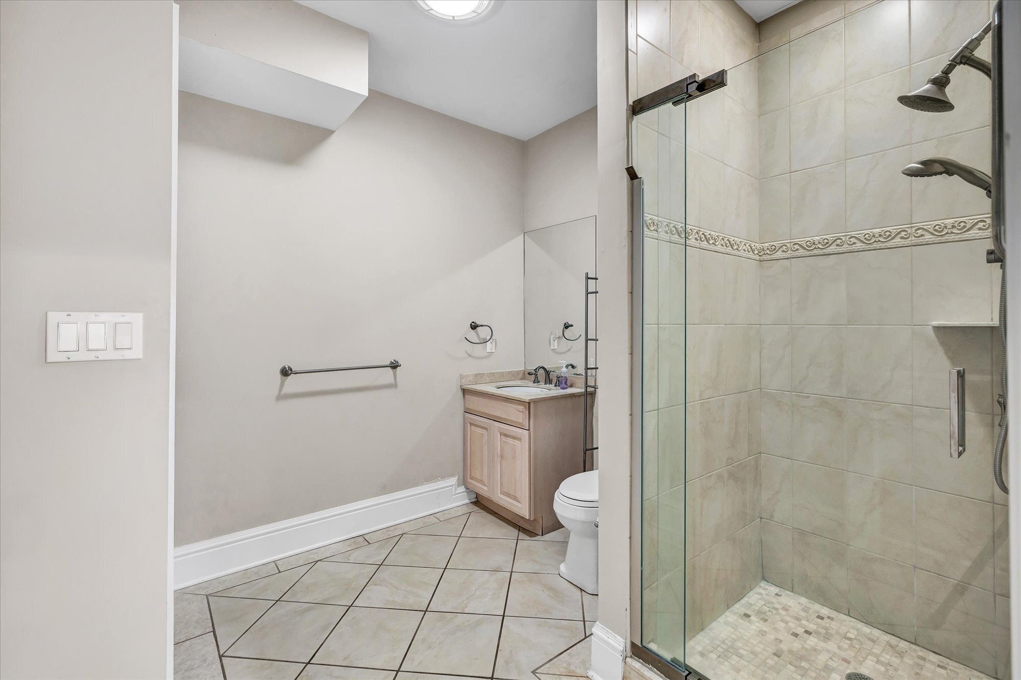 139 Jelliff Mill Road New Canaan, CT 06840 - Photo 35 of 40 a bathroom with a granite countertop shower and a sink