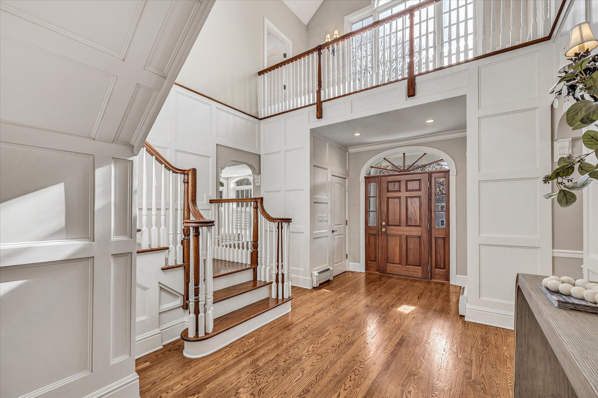 139 Jelliff Mill Road New Canaan, CT 06840 - Photo 6 of 40 a view of hallway with stairs and wooden floor