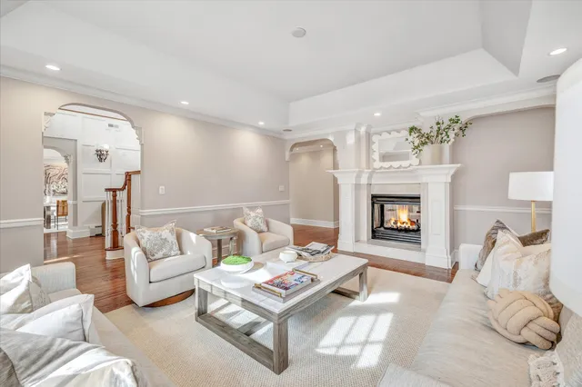 a view of hallway with stairs and wooden floor