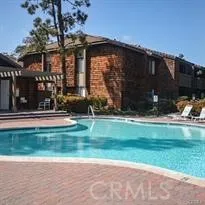 a backyard of a house with lots of green space and fountain