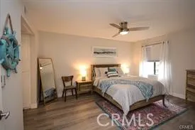 a bedroom with a bed and a mirror