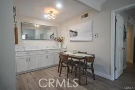 a kitchen with stainless steel appliances granite countertop a stove a sink a microwave and a refrigerator