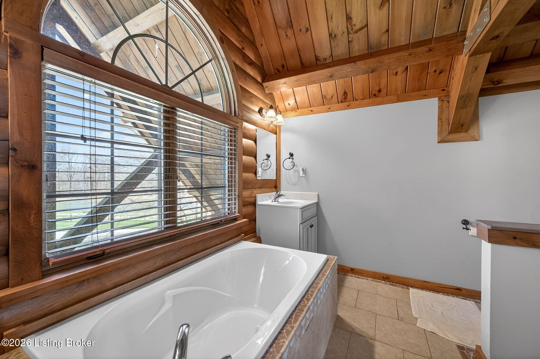 771 Mud Splash Road Elizabethtown, KY 42701 - Photo 57 of 85 Tile flooring, a tile-surround shower, and a vaulted ceiling round out the shared bath