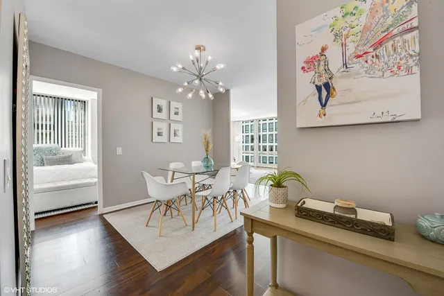 a view of a dining room with furniture window and wooden floor