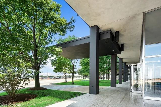 a view of a street with a tree