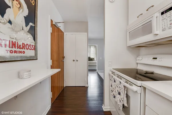 a kitchen with stainless steel appliances a sink and a refrigerator